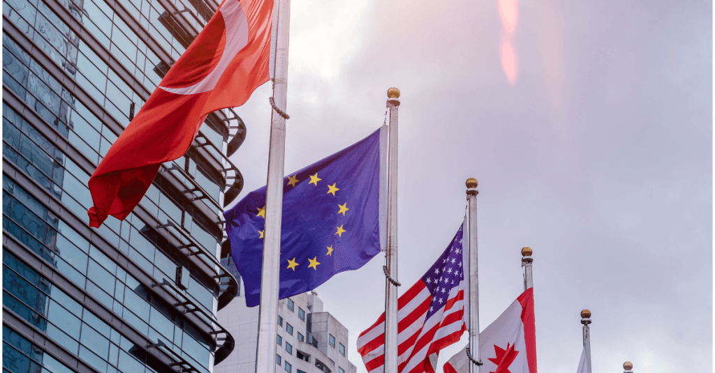 Banderas internacionales junto a la Unión Europea como representación de la fiscalidad de la I+D+i en distintos mercados.